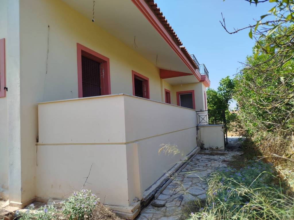 two-level farm house is for sale