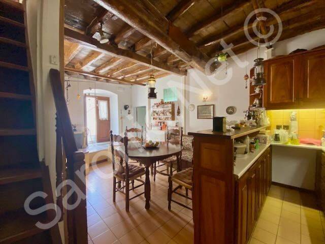 Kitchen with some modern fittings, to side entrance door