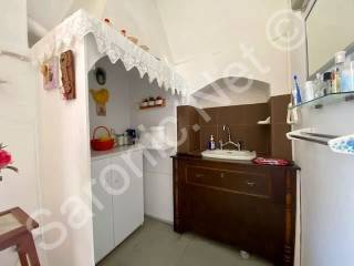 Top of internal stairs, vanity unit with plumbed basin