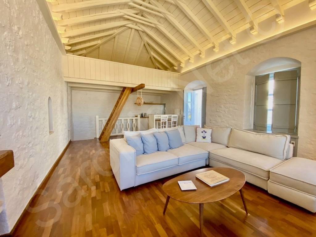 Living space, stairs to lower level in back left corner