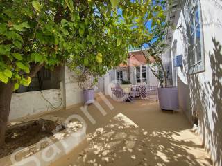 Entrance courtyard with fresh water cisterna under table
