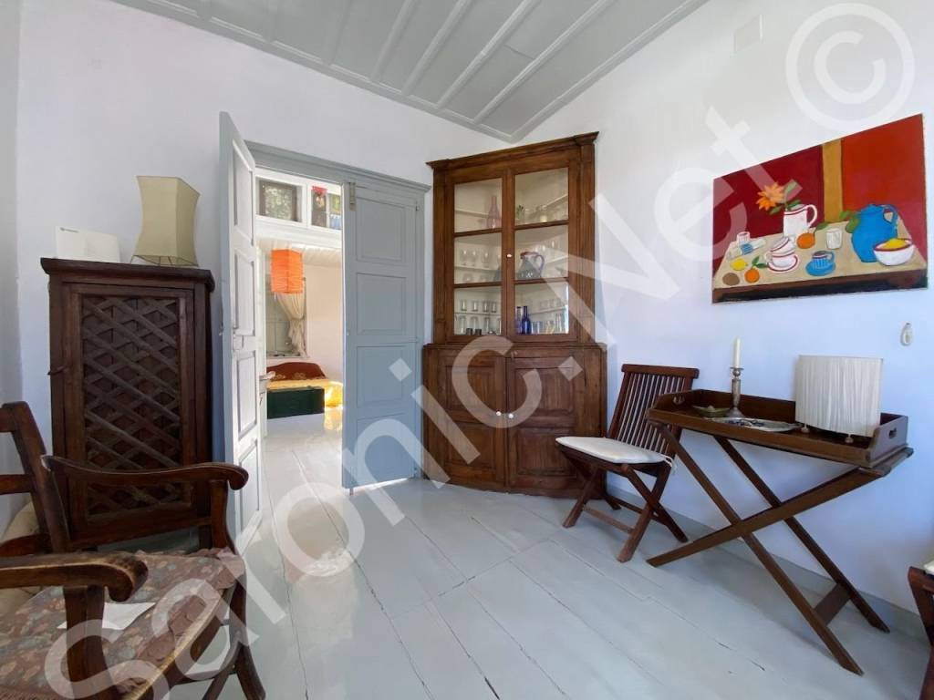 Siting room to entrance hall and across to bedroom 1