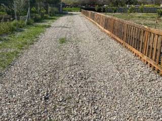 Entrance dirt road to the hill top