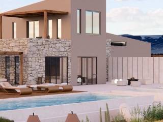 Idiotike pisina me diamorphomeno kepo sten Pege.