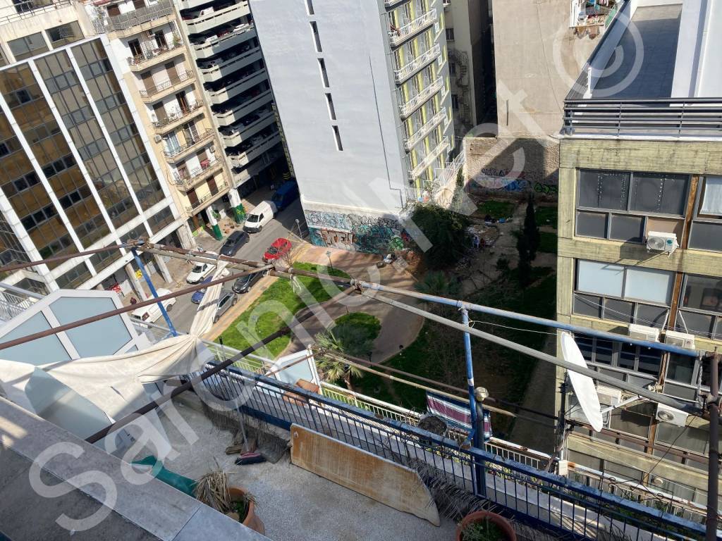View down from east roof terrace overlooking public garden