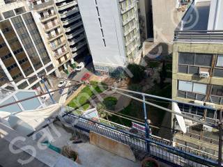 View down from east roof terrace overlooking public garden