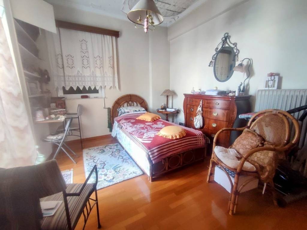 SUNNY BEDROOM WITH WINDOW AND BALCONY DOOR