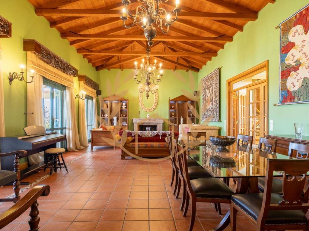 Formal dining room and living area with fireplace.